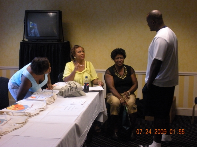 Host Committee going over last minute details prior to registration on our first full day