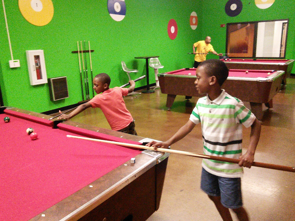 Its never to early to learn how to shoot pool. 