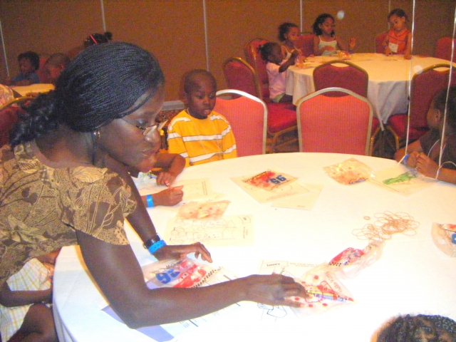 Cousin Margaret Billingsley assists the kids with their coloring activities. 